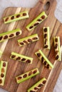 Homemade ants on a log with celery, peanut butter and raisins on a wooden board, top view. Close-up Royalty Free Stock Photo