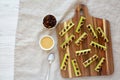 Homemade ants on a log with celery, peanut butter and raisins on a wooden board, top view. Copy space Royalty Free Stock Photo