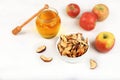 Homemade apple chips in a cup with apples and honey on a white background, in autumn apples are baked in the oven or dryer for