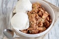 Homemade Apple Crisp or Crumble Topped with Vanilla Ice Cream Royalty Free Stock Photo