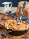 Homemade apple pie with caramel sauce on a wooden table. Close-up, selective focus on the pie. Near a jar of caramel, milk and Royalty Free Stock Photo