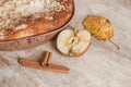 Homemade apple pie and cinnamon on vintage wooden background texture. Top view. Copy, empty space for text