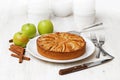 Homemade apple pie on white table