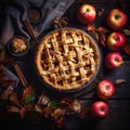 A Homemade apple pies on rustic background and apples, classic dessert for Thanksgiving, top view,