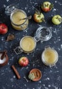 Homemade apple sauce in glass jars on dark background. Top view. Royalty Free Stock Photo