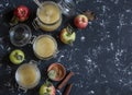 Homemade apple sauce in glass jars on dark background. Top view, free space for text. Royalty Free Stock Photo