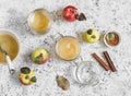 Homemade apple sauce in glass jars on light background Royalty Free Stock Photo