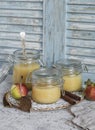 Homemade apple sauce in glass jars on rustic background Royalty Free Stock Photo