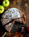 Homemade apple and sultana cake, cut and served with the filling visible.