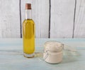 Homemade argan oil face cream, in a glass jar with a bottle of oil on the side Royalty Free Stock Photo