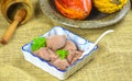 Homemade artisanal chocolate ice cream on a ceramic bowl with spoon and cacao pods on the background