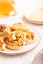 Homemade asian salted cookies, cup of green tea on gray concrete, side view, selective focus