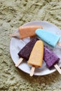 Homemade assorted flavors and colors of frozen yogurt or icecream popsicles from fruits. Summer ice dessert. Healthy food. Copy s Royalty Free Stock Photo