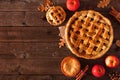 Homemade autumn apple pie, top view corner border over a rustic wood background Royalty Free Stock Photo