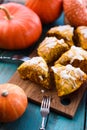 Homemade autumn pastry. Pumpkin scone triangles with sugar icing