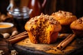 Homemade Autumn Pumpkin Spice Muffins with Pecan nuts. Fall and winter baking. Old rustic wooden background