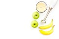 Homemade baby food. Cook puree with apple and banana with immersion blender. White background with toy top view space Royalty Free Stock Photo