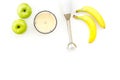 Homemade baby food. Cook puree with apple and banana with immersion blender. White background with toy top view space Royalty Free Stock Photo