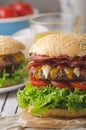 Homemade bacon burger with lettuce and cheddar