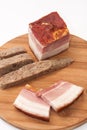 Homemade bacon and liverwurst on board Royalty Free Stock Photo