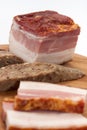 Homemade bacon and liverwurst on board Royalty Free Stock Photo