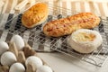 Homemade baked bakery or dessert, a variety of Hong Kong style bread or bun place on a cooling rack on striped placemat Royalty Free Stock Photo