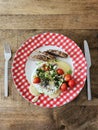 Homemade baked camembert cheese with green onions, rosemary, cherry tomatoes, chives and fresh bread Royalty Free Stock Photo