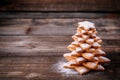 Homemade baked Christmas gingerbread tree with icing sugar