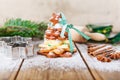 Homemade baked Christmas gingerbread tree on vintage wooden back