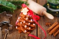 Homemade baked Christmas gingerbread tree on vintage wooden back