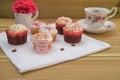 Mothers day words with homemade mini cakes on a wooden tray Royalty Free Stock Photo