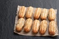 Homemade baked mini chocolate filled churros on black stone background Royalty Free Stock Photo