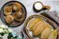 Homemade baked pasties with cabbage and sweet buns with sugar and cinnamon Royalty Free Stock Photo
