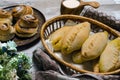 Homemade baked pasties with cabbage and sweet buns with sugar and cinnamon Royalty Free Stock Photo