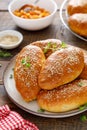 Homemade baked pies or patties stuffed with cabbage on wooden background Royalty Free Stock Photo