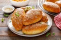 Homemade baked pies or patties stuffed with cabbage on wooden background Royalty Free Stock Photo