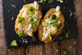 Homemade baked potato with broccoli, chicken and cheese closeup.