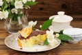 Homemade baked pudding with chololate icing, jasmine flowers and Royalty Free Stock Photo