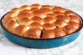 Homemade Baked Rolls in a Pan on Marble Background