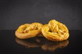 Homemade baked salt pretzel on dark background. Oktoberfest concept