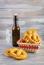 Homemade baked salt pretzel on wooden background. Oktoberfest concept