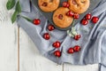 Homemade baking. Cupcakes with cherries.Dessert decorates with fresh berries and leaves. Wooden background. Food styling Royalty Free Stock Photo
