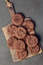 Homemade Baking Desserts Sweet Food, Brownie Round Dark Brown Chocolate Coffee Cookies with fresh Cocoa on a cutting board on a Royalty Free Stock Photo