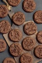 Homemade Baking Desserts Sweet Food, Brownie Round Dark Brown Chocolate Coffee Cookies with fresh Cocoa on a cutting board on a