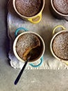 Homemade baking: gluten-free pumpkin custards in ramekins with spoon Royalty Free Stock Photo