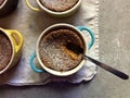Homemade baking: gluten-free pumpkin custards in ramekins with spoon