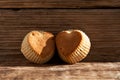 Homemade baking. Heart shaped gluten free muffins on a wooden background. Selective focus, rustic style