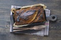 Homemade banana bread with cinnamon on a wooden background, close up, top view