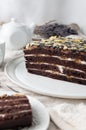 Homemade Banana Cake. With biscuit chocolate cakes. Soaked in butter cream. Garnished with Chocolate. On a white plate. In the Royalty Free Stock Photo