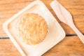 Homemade banana cupcake on wooden plate